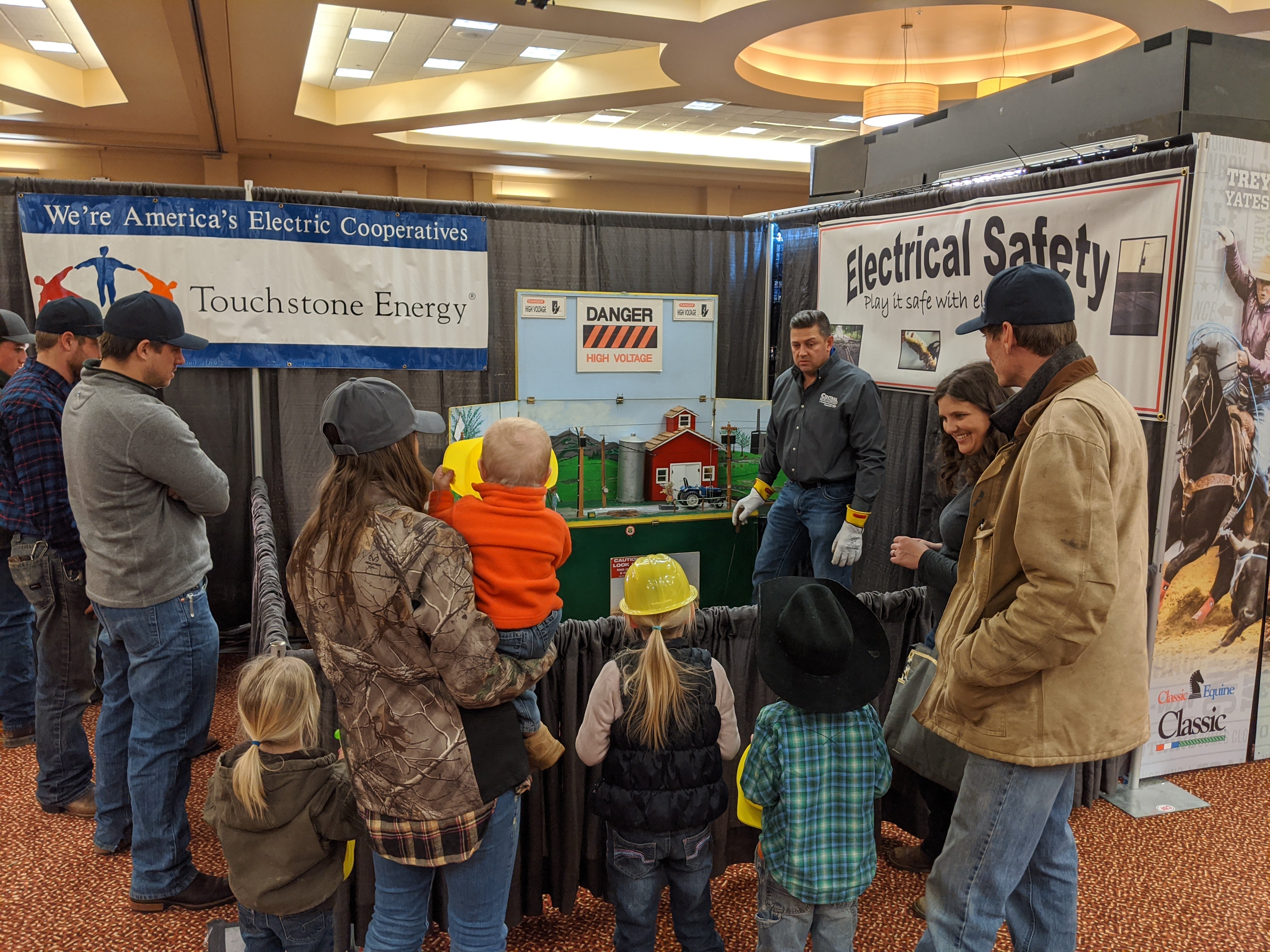 Group at Touchstone Energy Stock Show Booth