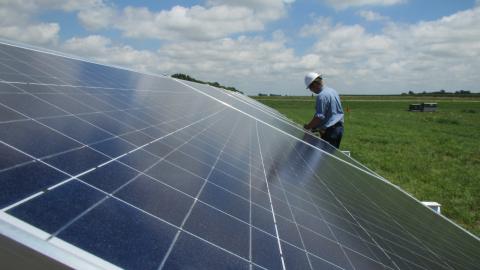 Rodney Weber installing solar panel