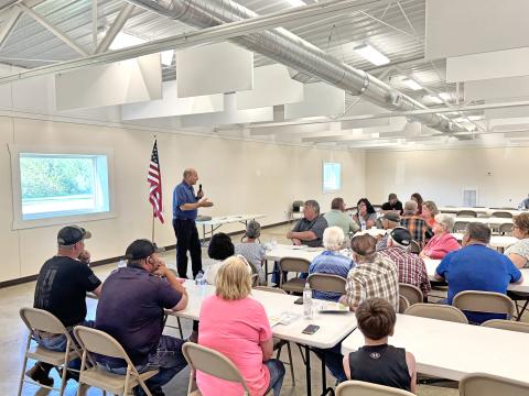 Ken speaking at meeting
